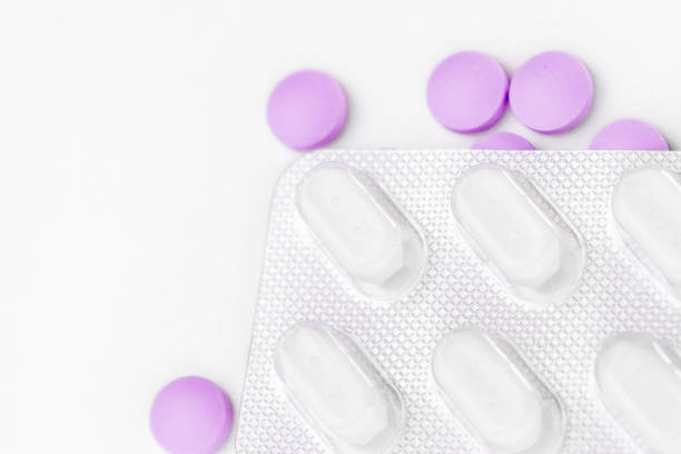 istock Medicine pills packed in blisters isolated on white background, view from above. 1485305798
