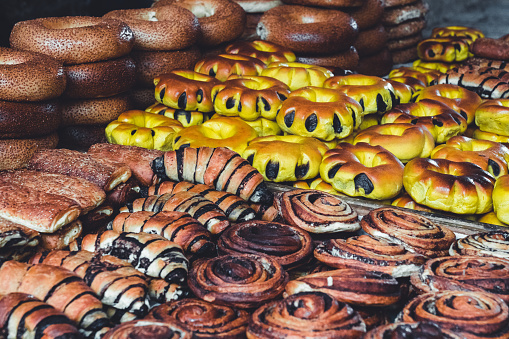 Fresh Israeli Sweets: Mixture of Arab, Israeli, Jewish Handmade Sweets, Sweet Bites, Cakes and Pastry Detail offered on market stalls in the Souk of Old City Jerusalem. Detail of sweet market stall food and snacks. Jerusalem Old City, Israel, Middle East.