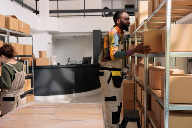 istock African american worker organizing cardboard boxes 1485309609