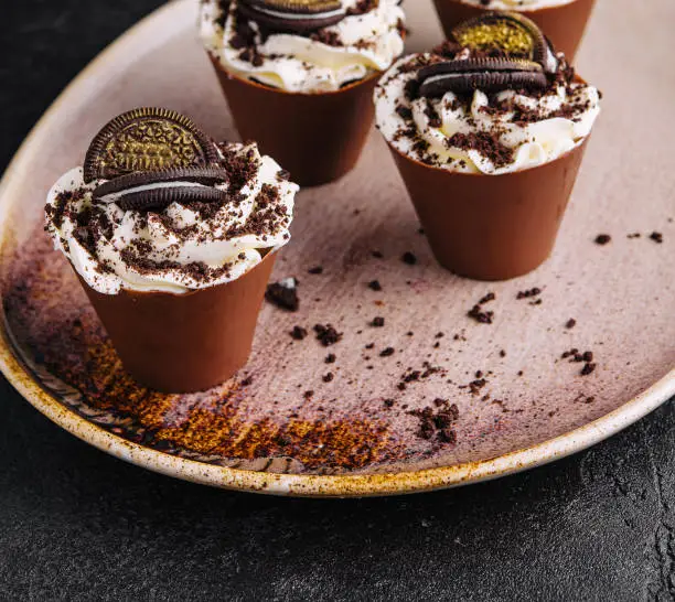 Photo of Tiramisu with chocolate cookie cookies on plate