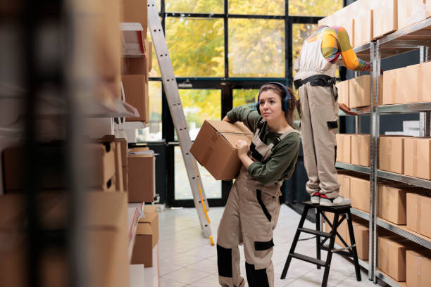 istock Coworker holding cardboard box preparing order 1485310728