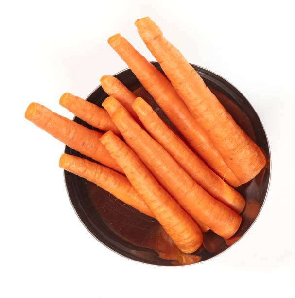 istock Pile of fresh carrot sticks isolated on white 1485312722