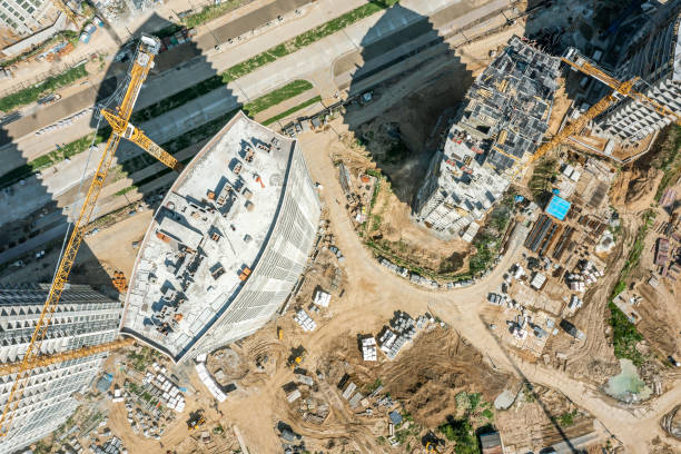 istock busy construction site with construction equipment, materials and working cranes. aerial view. 1485312794