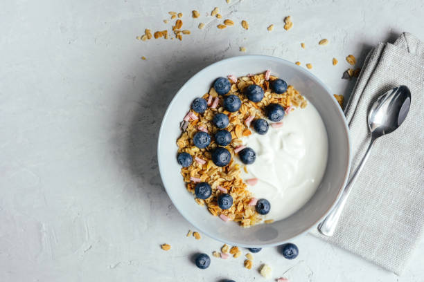 istock Yogurt with muesli and berries on a gray background. 1485316399