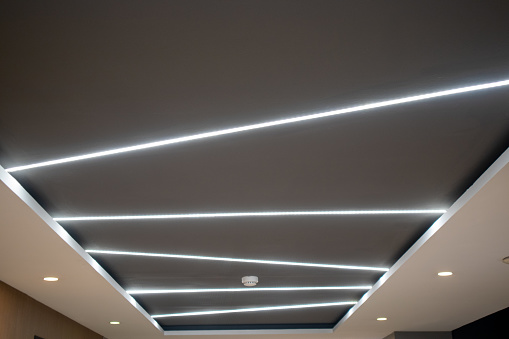 The ceiling alternates with embedded lighting.
