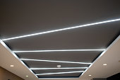 The ceiling alternates with embedded lighting.