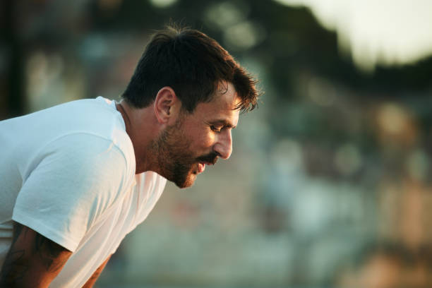 istock Young male athlete taking a break from sports training. 1485317805
