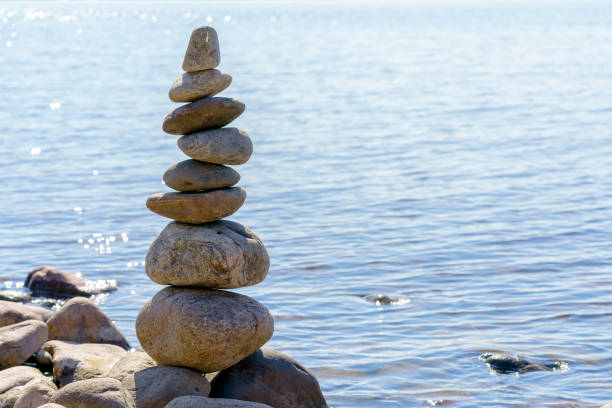 istock Pyramid of stones. Unstable balance of stone objects. 1485319895