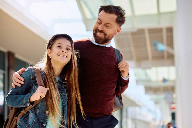 istock Happy father and daughter waiting at the train station. 1485323849