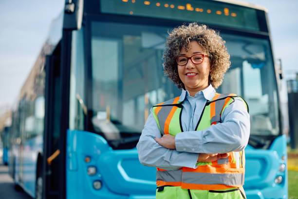 istock Confident female bus driver at the station looking at camera. 1485324196