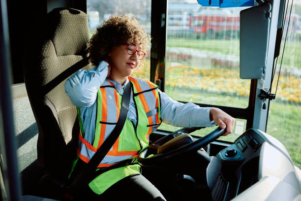 istock Female bus driver having a neck pain while driving. 1485324243