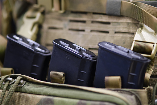 Army pouches and a holster with weapons for military uniforms. Bags for items and cartridges for the machine