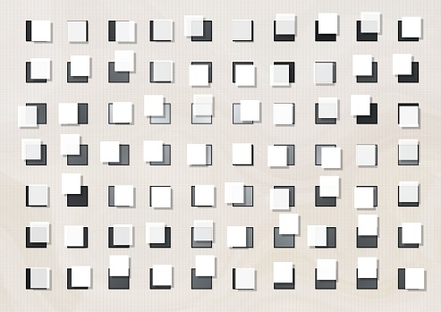 black, white, and gray squares on a white background in random order