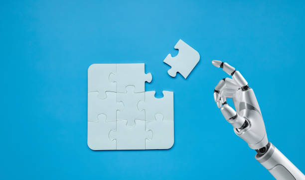 istock Robot and Puzzle pieces on blue background, Jigsaw puzzle with missing piece artificial intelligence, Missing jigsaw puzzle pieces and business artificial intelligence concept. 1485333009