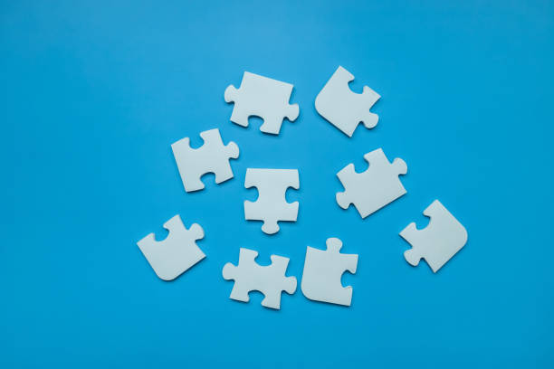 istock Top view Puzzle pieces on blue background, Jigsaw puzzle with missing piece, Missing jigsaw puzzle pieces and business concept. 1485333774