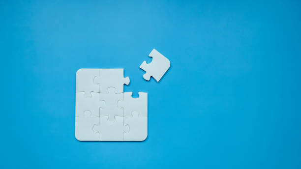 istock Top view Puzzle pieces on blue background, Jigsaw puzzle with missing piece, Missing jigsaw puzzle pieces and business concept. 1485333775
