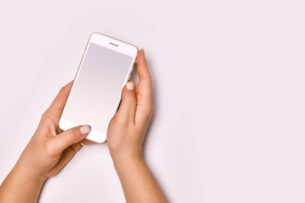 istock Female hands holding modern cellphone. 1485333792