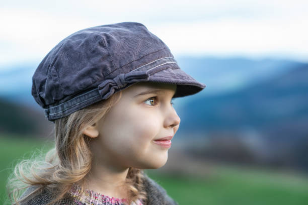 istock Little girl at a green spring field 1485336800