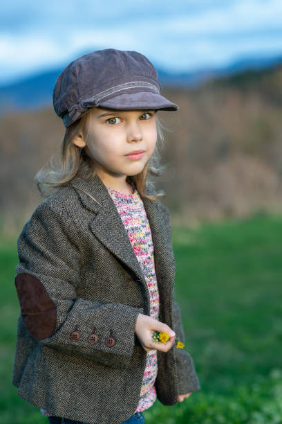 istock Little girl at a green spring field 1485336814