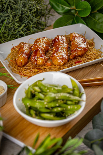Asian style meal Delicious balanced food concept, Asian style meal sticky sesame chicken sauces stock pictures, royalty-free photos & images