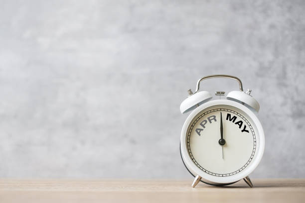 istock Hello May Changed from April month with vintage alarm clock on table background. Calendar, Monthly, New Start, Resolution, Goals, Plan, Action and Mission Concept 1485344634