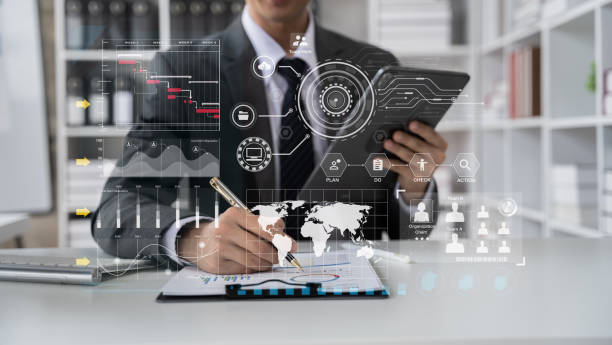 istock Businessman hand Project manager working and update tasks and Gantt chart scheduling virtual diagram.with tablet and laptop in office. 1485345252