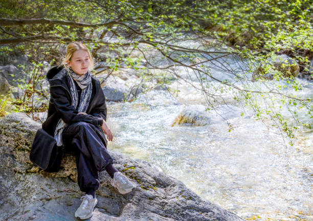 istock Inspiring walk along the mountain river in spring in Aridea 1485347024