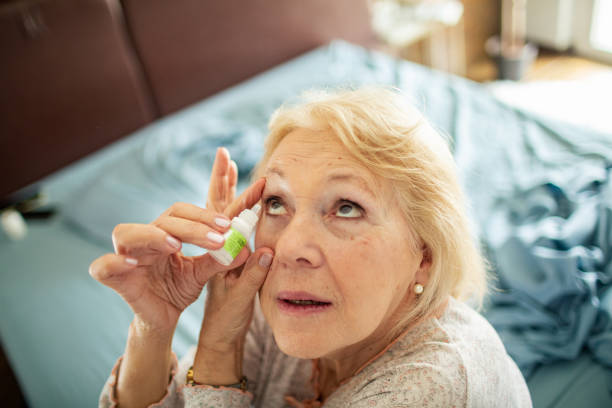 istock Senior woman using eye drops in the bedroom 1485348332