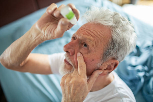 istock Senior man using eye drops in the bedroom 1485348352