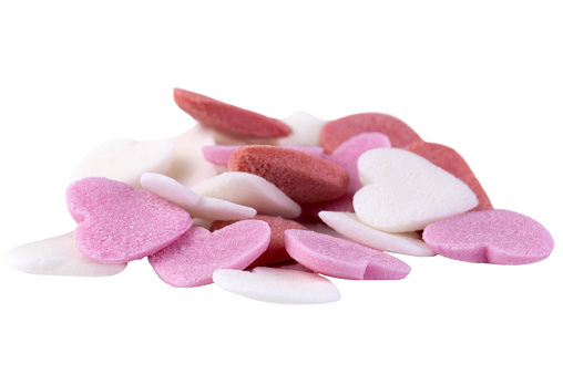 Heap of sugar hearts isolated on a white background.