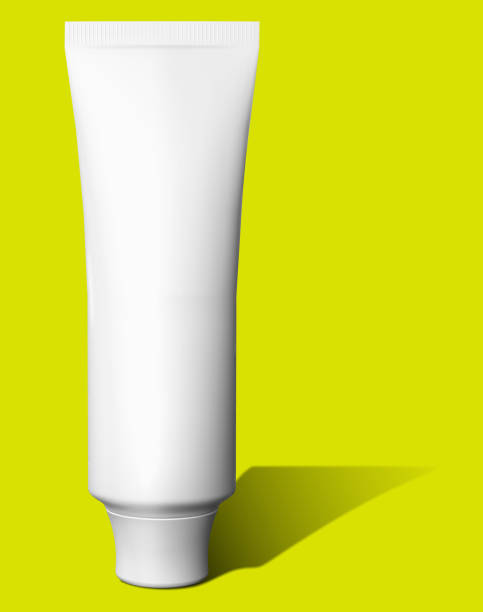 istock Cosmetics mockup template on yellow background. Plastic container for cosmetics products. Tube, cream pot, beauty products isolated on white background. 3D rendering. 1485350876