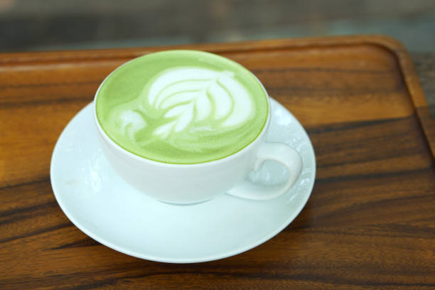 istock Hot green tea. Flower bubbles in a glass. 1485351782
