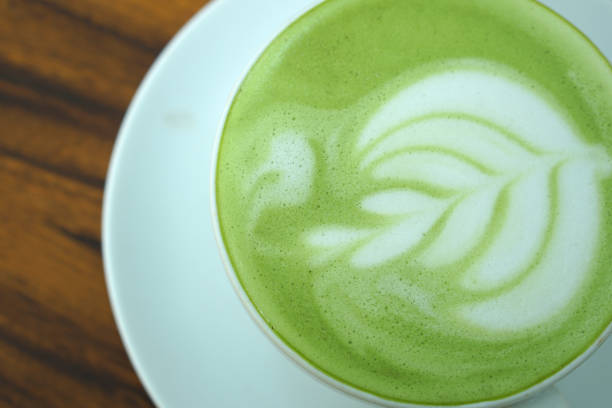 istock Hot green tea. Flower bubbles in a glass. 1485351828