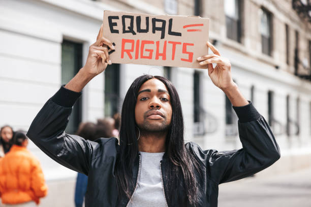 istock Non-binary person portrait with a Equal rights sign on cardboard 1485353321
