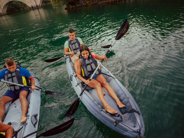 istock A group of friends enjoying having fun and kayaking while exploring the calm river, surrounding forest and large natural river canyons 1485358199