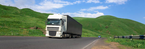 istock truck transports freight on highway 1485359280