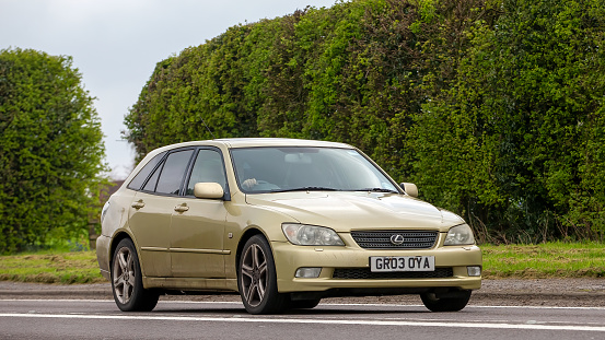 Berlin, Germany - 10 July, 2019: Toyota Camry Hybrid on a street. The Camry is one of the most popular sedan vehicles in the world.