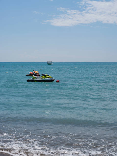 jet skis moored at sea