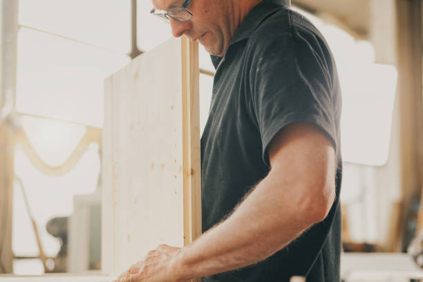 istock Strength and dedication of woodworker with glasses 1485361210