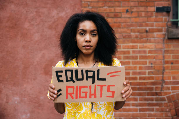 istock Woman holding a Equal Rights sign on cardboard 1485361427