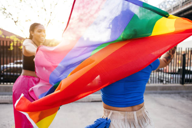 istock Two women on roller skates with a rainbow flag 1485361867