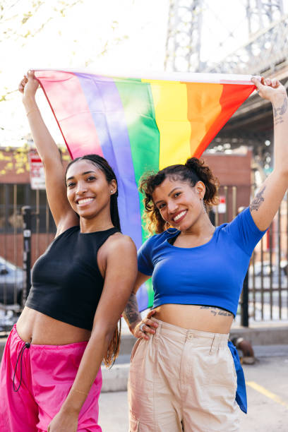 istock Two women on roller skates with a rainbow flag 1485362151