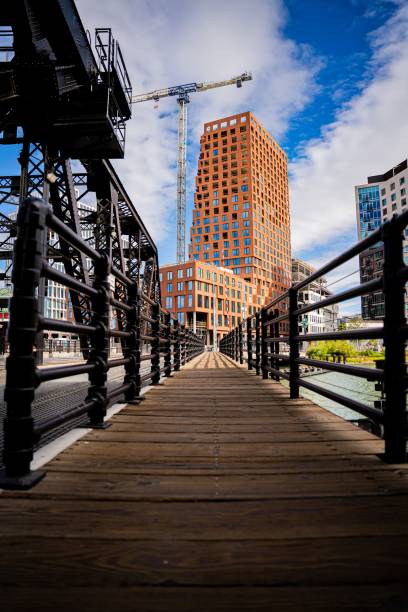 istock Boardwalk in front of a building under construction with a cloudy sky in the background 1485362256