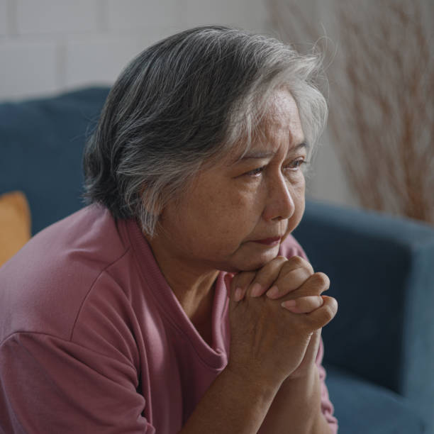 istock Asian mature woman with feeling depressed while talking to psychologist 1485364183