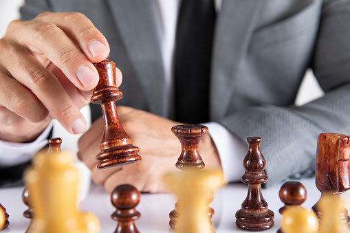 Business strategy concept with businessman making his next move