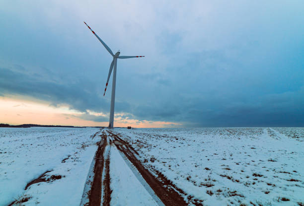 istock windmills in a snowy field with a cloudy sky in the background 1485365912