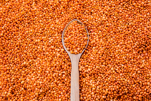 Red lentils and wooden spoon