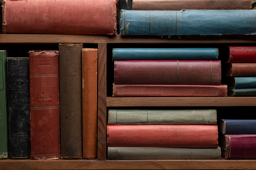 Old books on bookshelf background