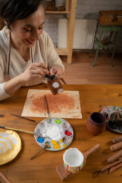 istock Woman painting a pottery 1485366745