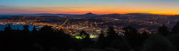 Photo of The sunset sky and the night view of Dunedin as seen from Signal Hill Lookout in Dunedin, New Zealand